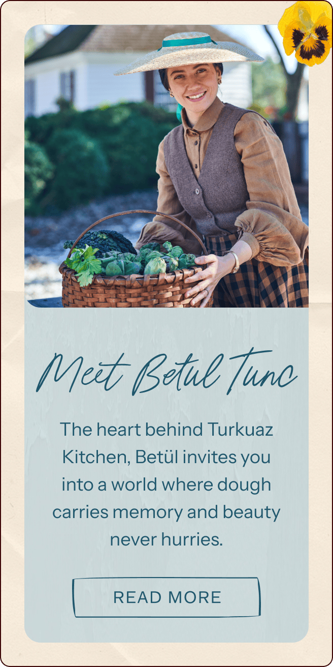 A woman in a hat and vest smiles while holding a basket of fresh vegetables. Text introduces Betül Tunc of Turkuaz Kitchen and invites readers to learn more. | Wonderly