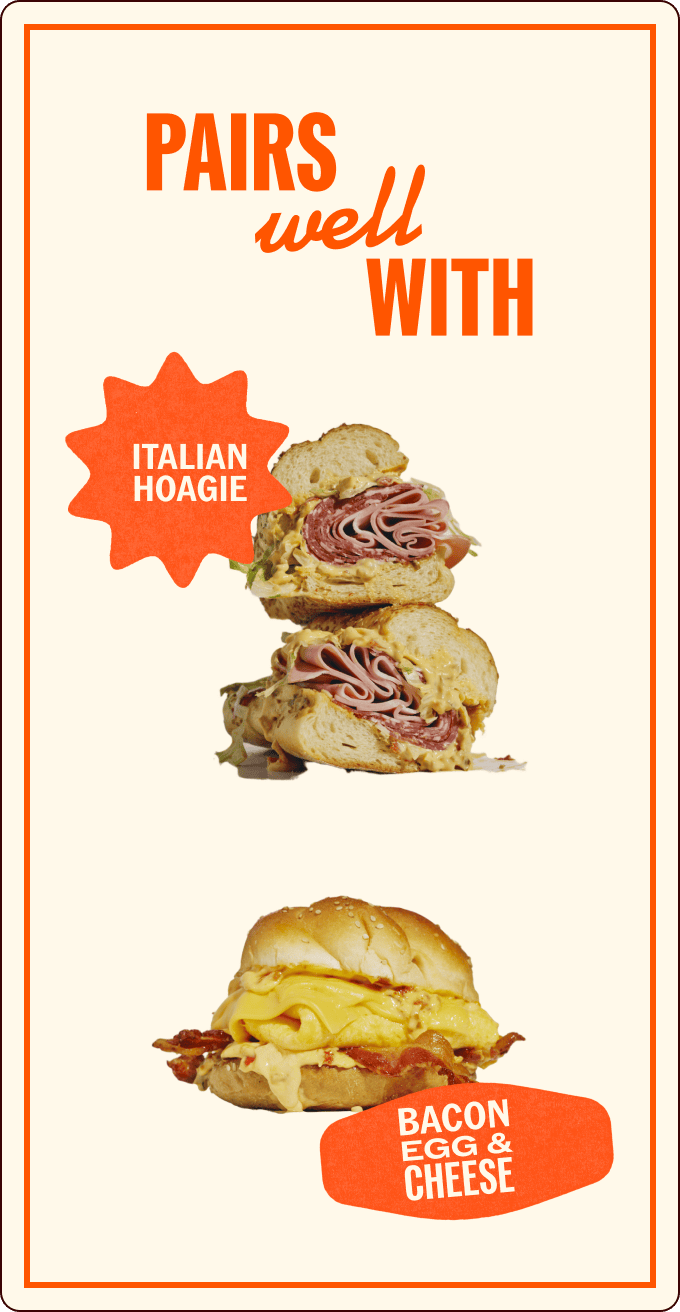 Two sandwiches are shown: an Italian hoagie stacked with deli meats, and a bacon, egg, and cheese sandwich on a bun. Text reads "Pairs well with. | Wonderly