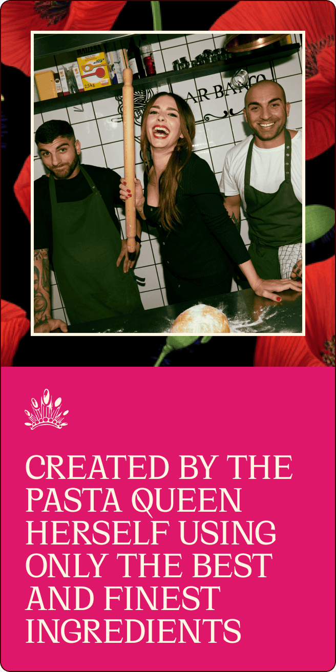 Three people in a kitchen, two men in green aprons and a smiling woman holding a rolling pin, stand behind a counter with dough. | Wonderly