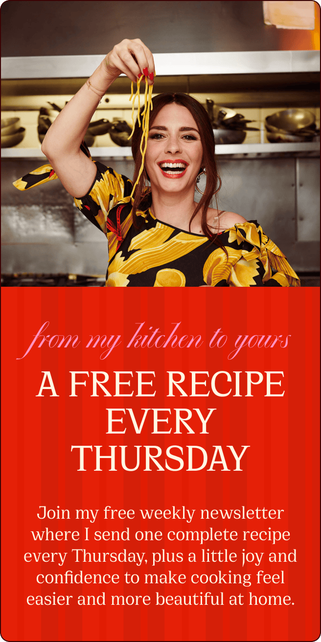 A smiling woman in a kitchen holds up fresh pasta. Text offers a free recipe every Thursday via a weekly email newsletter. | Wonderly