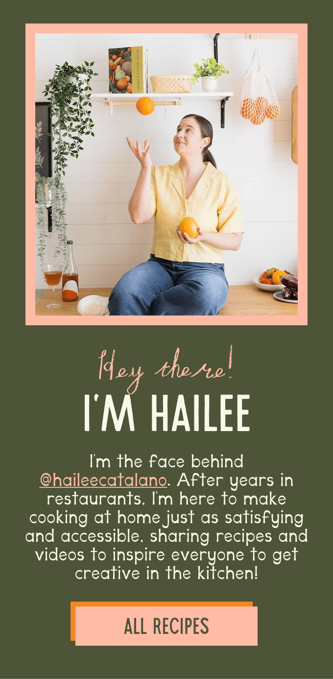 A woman sits on a kitchen counter holding an orange and smiling, surrounded by fruits and kitchen items, with text introducing her as Hailee, a recipe creator. | Wonderly