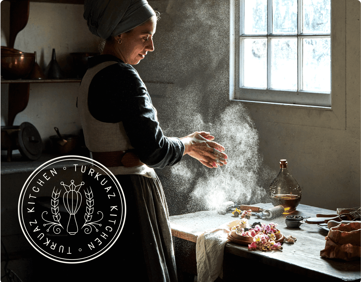 A woman in a vintage dress works with dough at a sunlit kitchen table. The website header reads “Turkuaz Kitchen, Food That Feels Like Home,” with navigation links above. | Wonderly