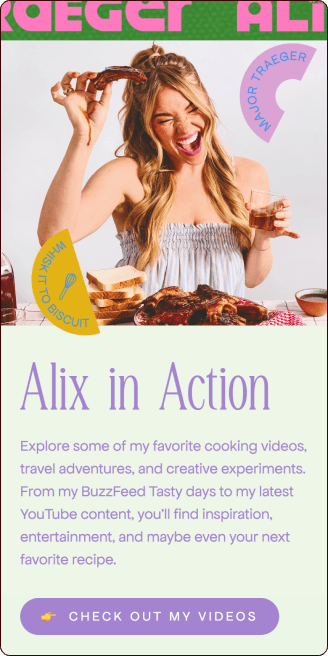 A woman smiles while holding up a biscuit, surrounded by food and a glass of wine, promoting her cooking and travel video series titled "Alix in Action. | Wonderly