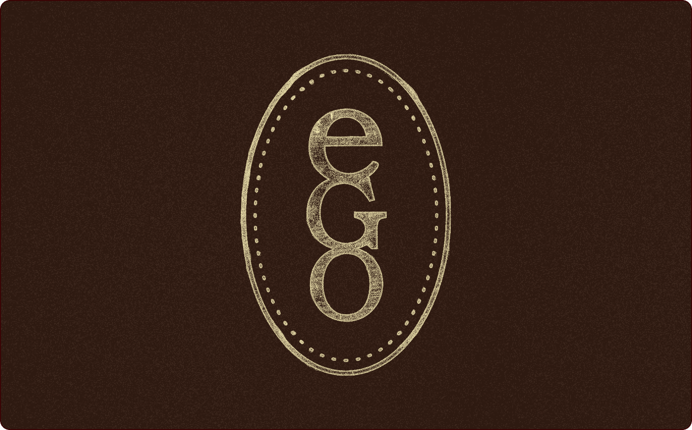 A brown background with the word "ego" in beige, vertically stacked inside an oval outlined with dotted lines. | Wonderly